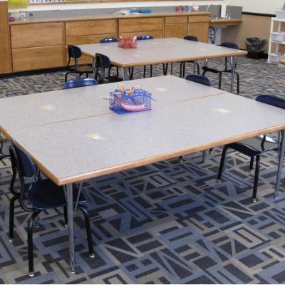 adjustable leg tables and student chairs in a classroom