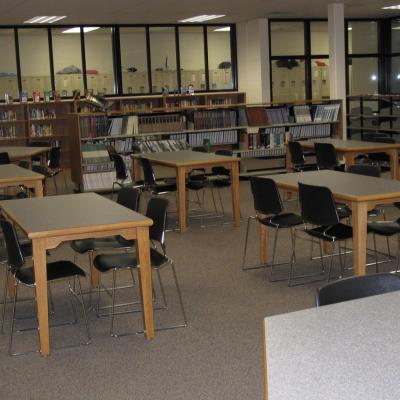 4 leg rectangular tables and chairs in a library