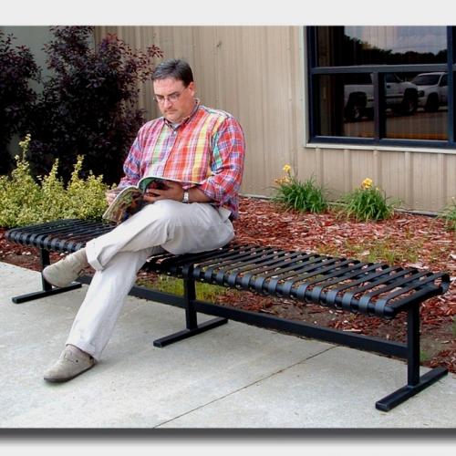 person siting on metal bench