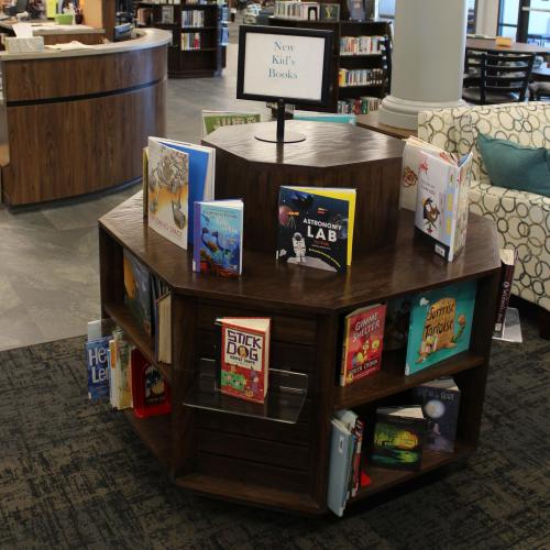 A two level octagon shaped display and bookcase